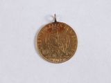 an image of a gold coin with a picture of a man on it
