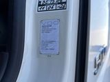 a close up of a car door with a sticker on it