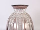a glass vase that is sitting on a table