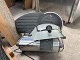 a machine that is sitting on the ground next to a chair