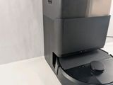 the robot is sitting on top of the box on the table
