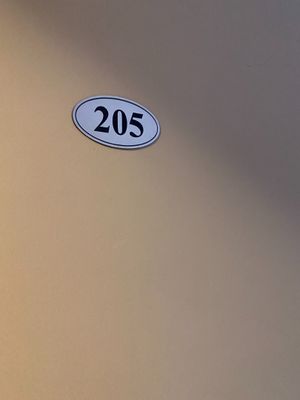 a close up of a sign on the side of a wall