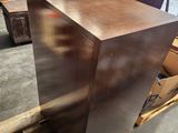 a picture of a piece of metal on a pallet in a warehouse