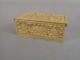 an image of a gold box sitting on top of a table