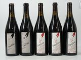 six bottles of wine are lined up in a row on a table