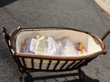 a baby in a crib on the street