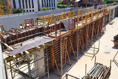 a construction site with scaffolding and scaffolding on the ground
