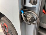 a close up of a car door handle with a hose attached