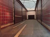 an image of a long hallway in a warehouse