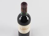 a bottle of wine that is sitting on a table