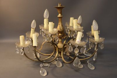a chandelier made of glass and gold colored metal