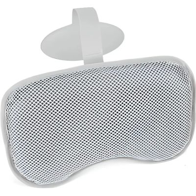 the back of a white head rester with a button on it
