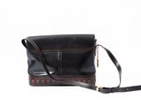 black leather cross body bag with red and orange design