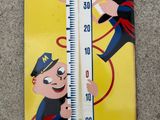a thermometer with a picture of a man on it
