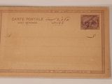 une vieille carte postale sur laquelle figure la photo d'un homme