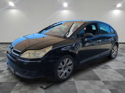 a picture of a black car in a garage