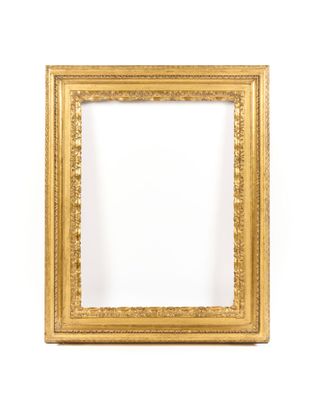 a gold frame on a white wall with a white background