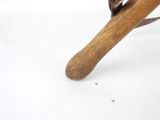 a small bird perched on top of a baseball bat