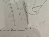 drawing of a man with a hat and a tie on a piece of paper