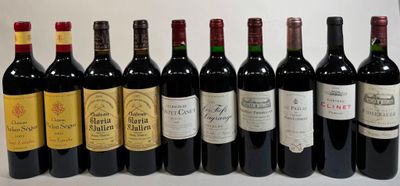several bottles of wine are lined up in a row on a table