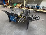 a close up of a table with tools on it in a warehouse