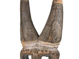 an image of a wooden mask with horns on a white background