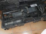 a black case with tools inside of it on a tiled floor