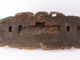 an old wooden carving of a man and a woman on a boat