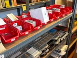 many bins on the shelves in the store