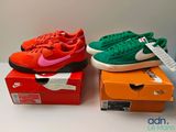 three pairs of shoes are sitting on top of boxes on a table