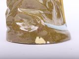 a vase that has a brown and blue design on it
