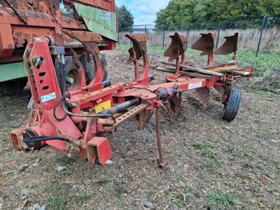 an image of a tractor with a plow attached to it