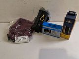 a camera and some other items sitting on a table