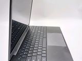 a black laptop with a silver keyboard on a white surface