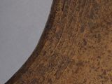 a close up of a large bronze vase with a white background