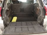 the back of a car with the trunk open and a mat in the trunk