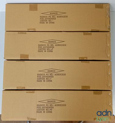 four boxes stacked on top of each other on top of a table