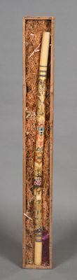 a wooden box with a tube of toothpaste inside of it