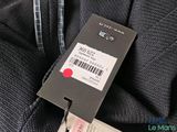 a label on the back of a jacket with a barcode on it