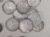 a lot of coins that are on the table