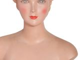 an image of a female mannequin head with blonde hair and blue eyes