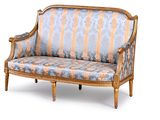a blue and gold striped couch on a white background