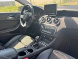 the interior of a car with a steering wheel, dashboard, and dashboard controls