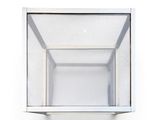 a glass shelf that has a mirror on it