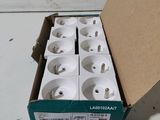 a box of white electrical plugs sitting on a table