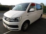 the white van is parked on the side of the road
