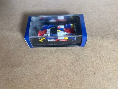 a toy car in the box on the floor