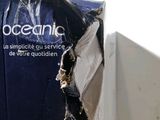 a piece of plastic wrapped around a box with a logo on it