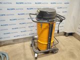 a yellow and black vacuum on a cart in a room