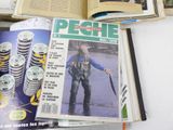 a magazine with a picture of a man holding a fish on it